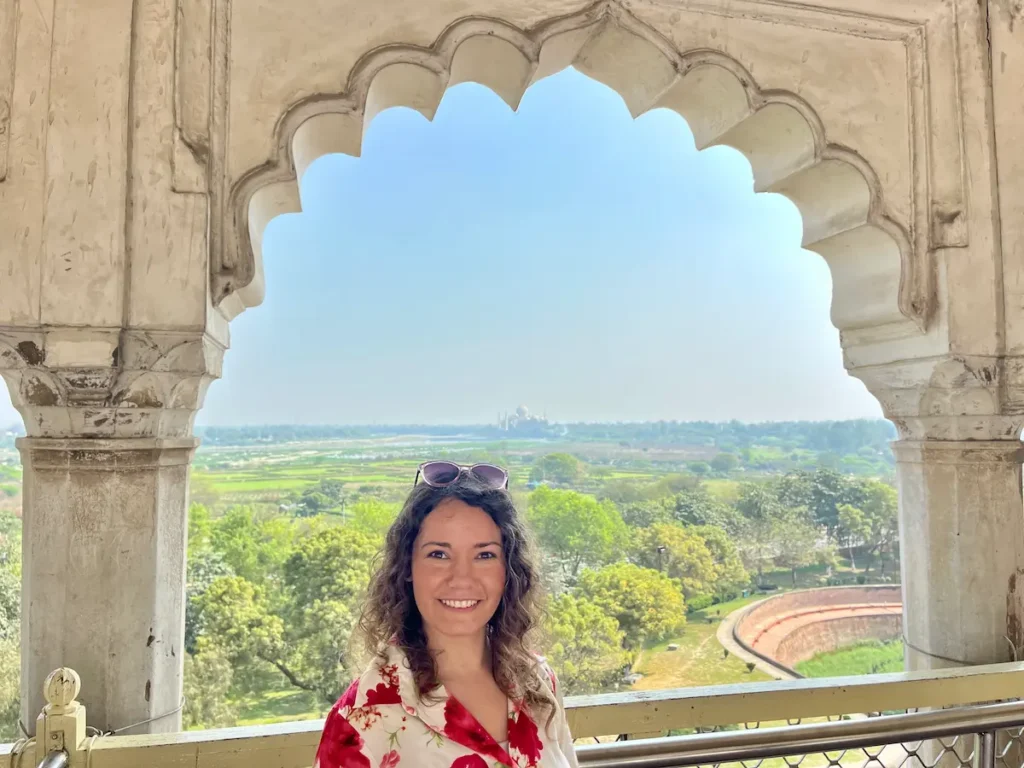 Solo female traveler in Agra Red Fort with Taj Mahal view