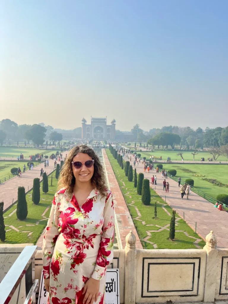 Solo female traveler at the Taj Mahal during her India trip.