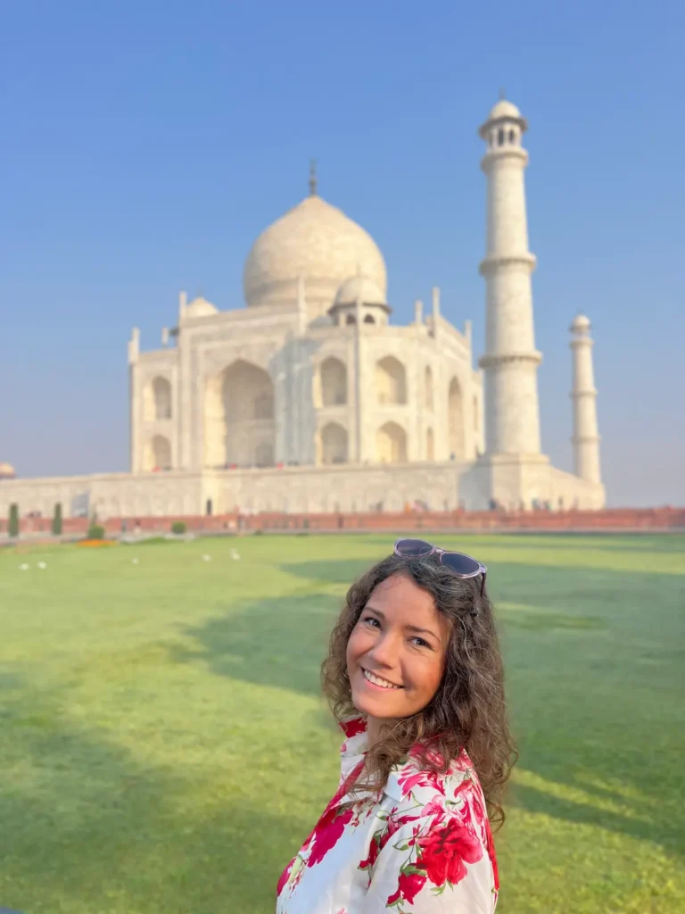 Solo female traveler visiting the Taj Mahal in India.